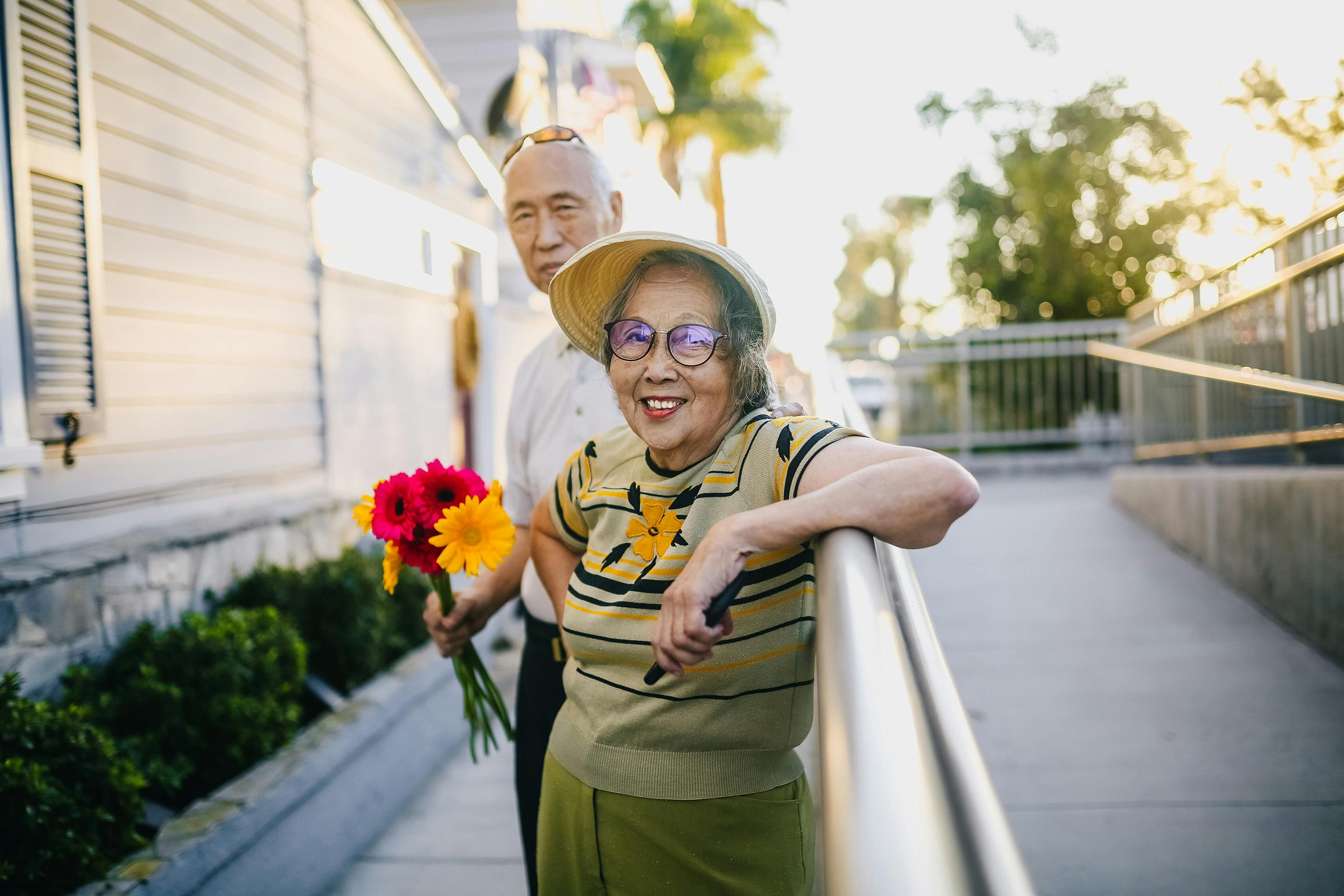 older asian american couple w flowers