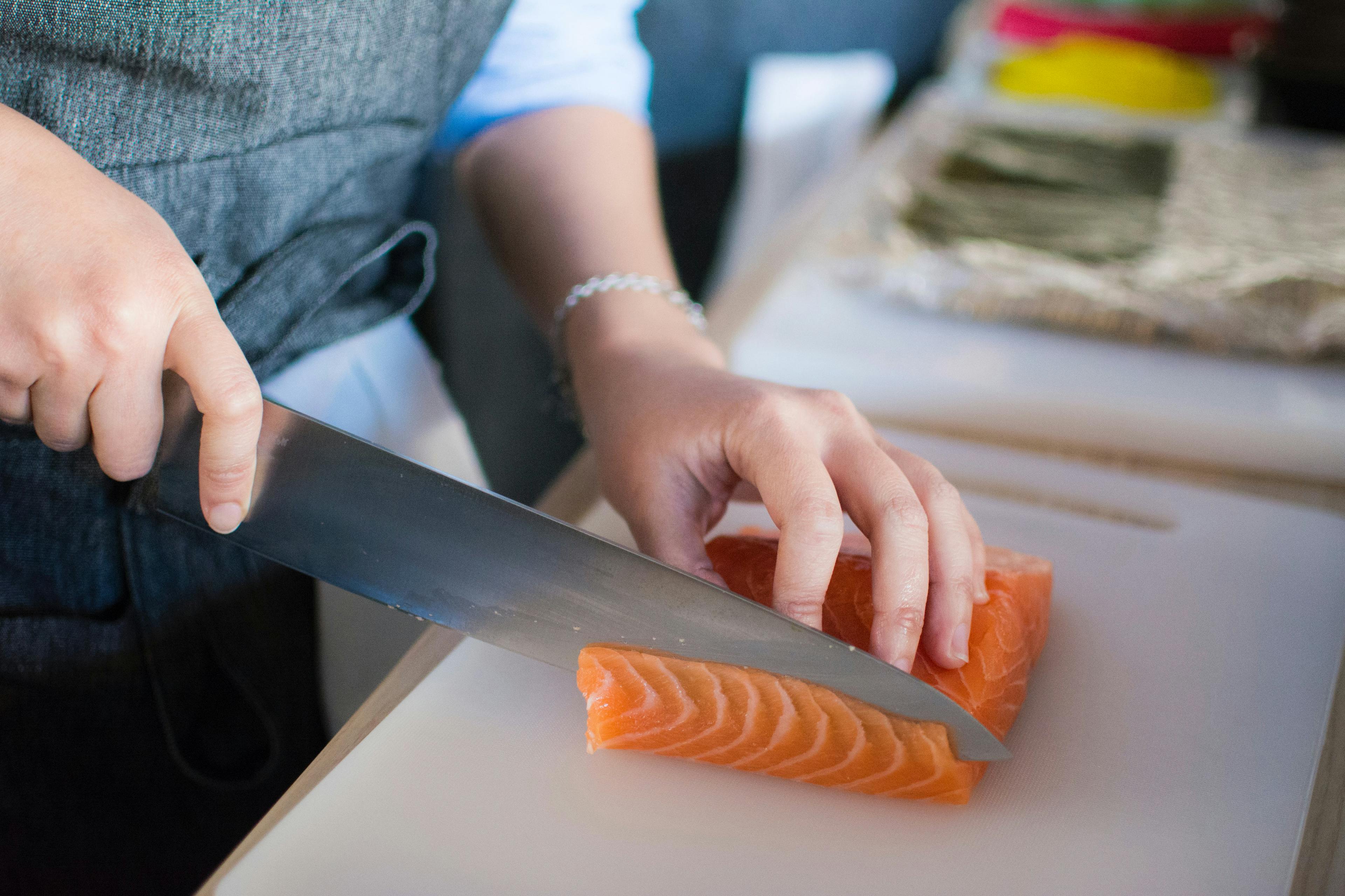 Slicing salmon.